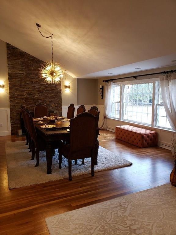 12 Hemlock Road Boxford, MA 01921 - Photo 19 of 42 a living room with furniture and a chandelier