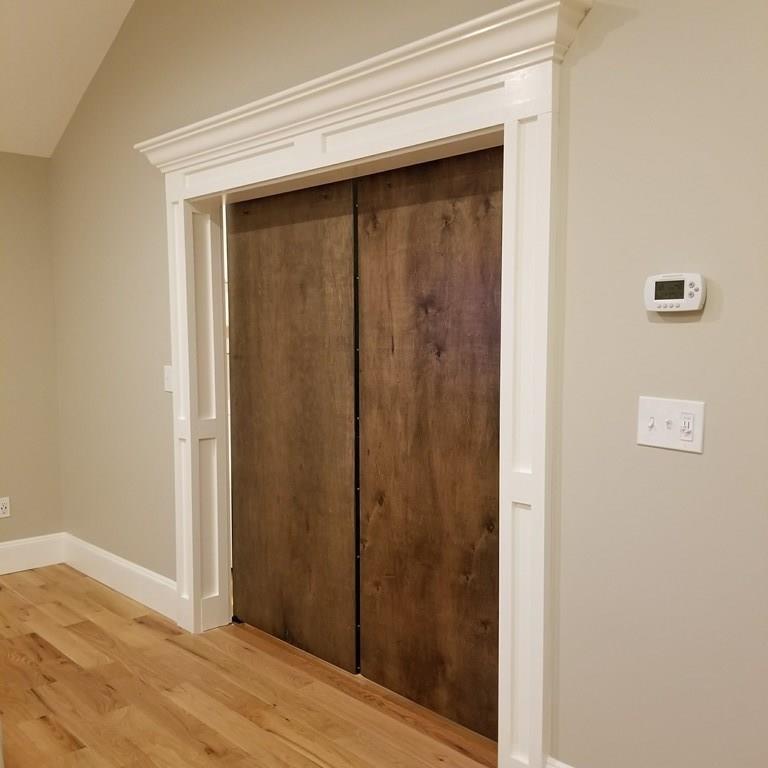 12 Hemlock Road Boxford, MA 01921 - Photo 22 of 42 a view of a hallway with wooden floor