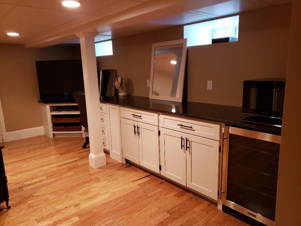 12 Hemlock Road Boxford, MA 01921 - Photo 36 of 42 a kitchen with granite countertop white cabinets and appliances