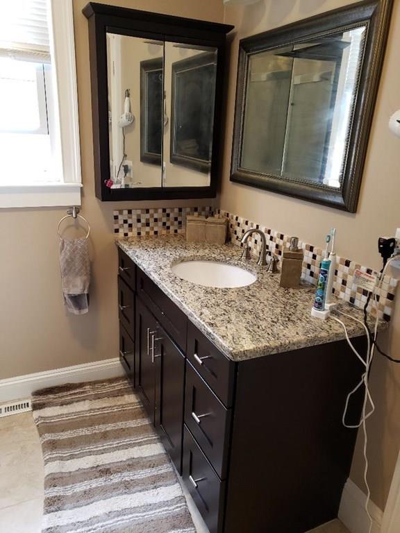 12 Hemlock Road Boxford, MA 01921 - Photo 39 of 42 a bathroom with a granite countertop sink and a mirror
