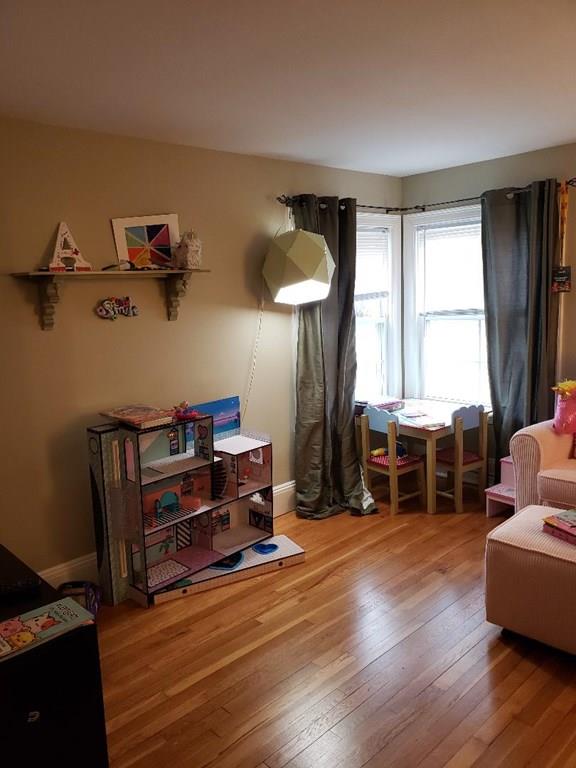 12 Hemlock Road Boxford, MA 01921 - Photo 41 of 42 a living room with furniture a window and wooden floor
