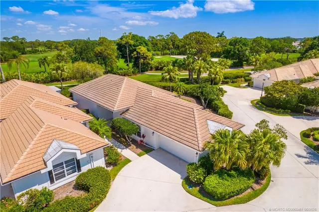 a view of a garden with an ocean view