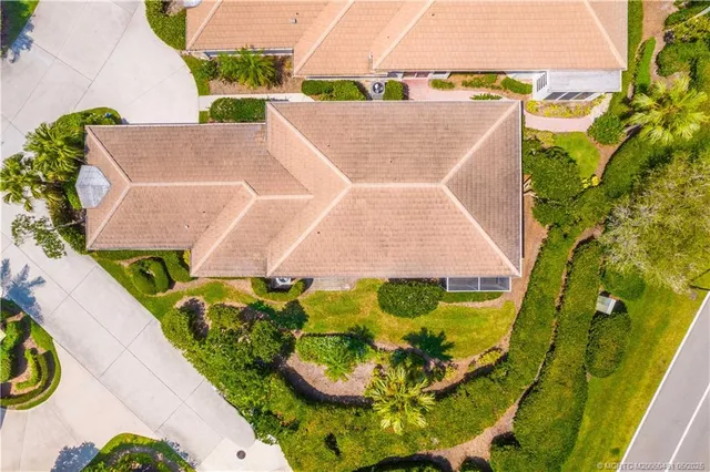 an aerial view of a house with a swimming pool