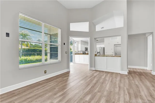 a view of a kitchen cabinets a wooden floor and a kitchen