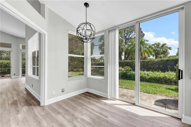 a view of a room with wooden floor balcony and outdoor view