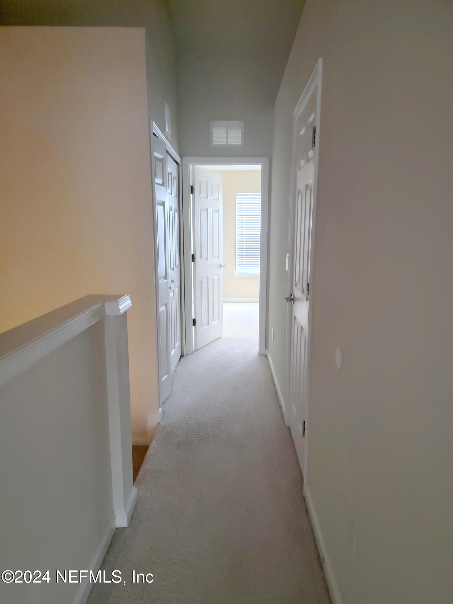 6801 Arching Branch Circle Jacksonville, FL 32258 - Photo 11 of 14 a view of a hallway with wooden floor