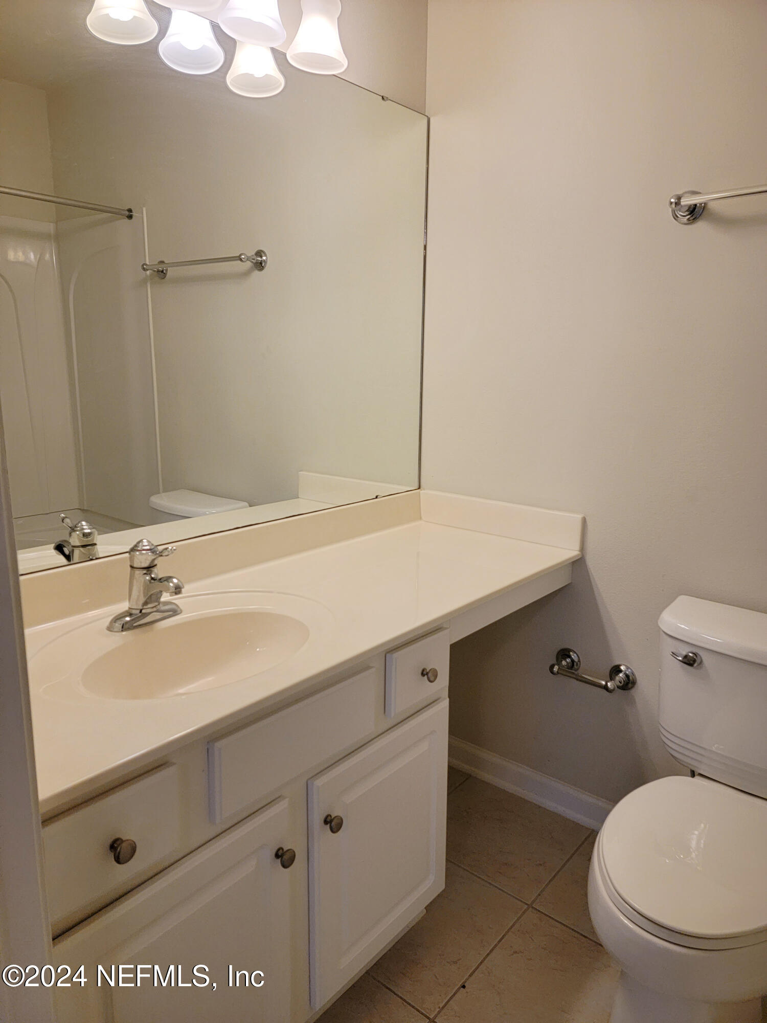 6801 Arching Branch Circle Jacksonville, FL 32258 - Photo 13 of 14 a bathroom with a sink a toilet and vanity