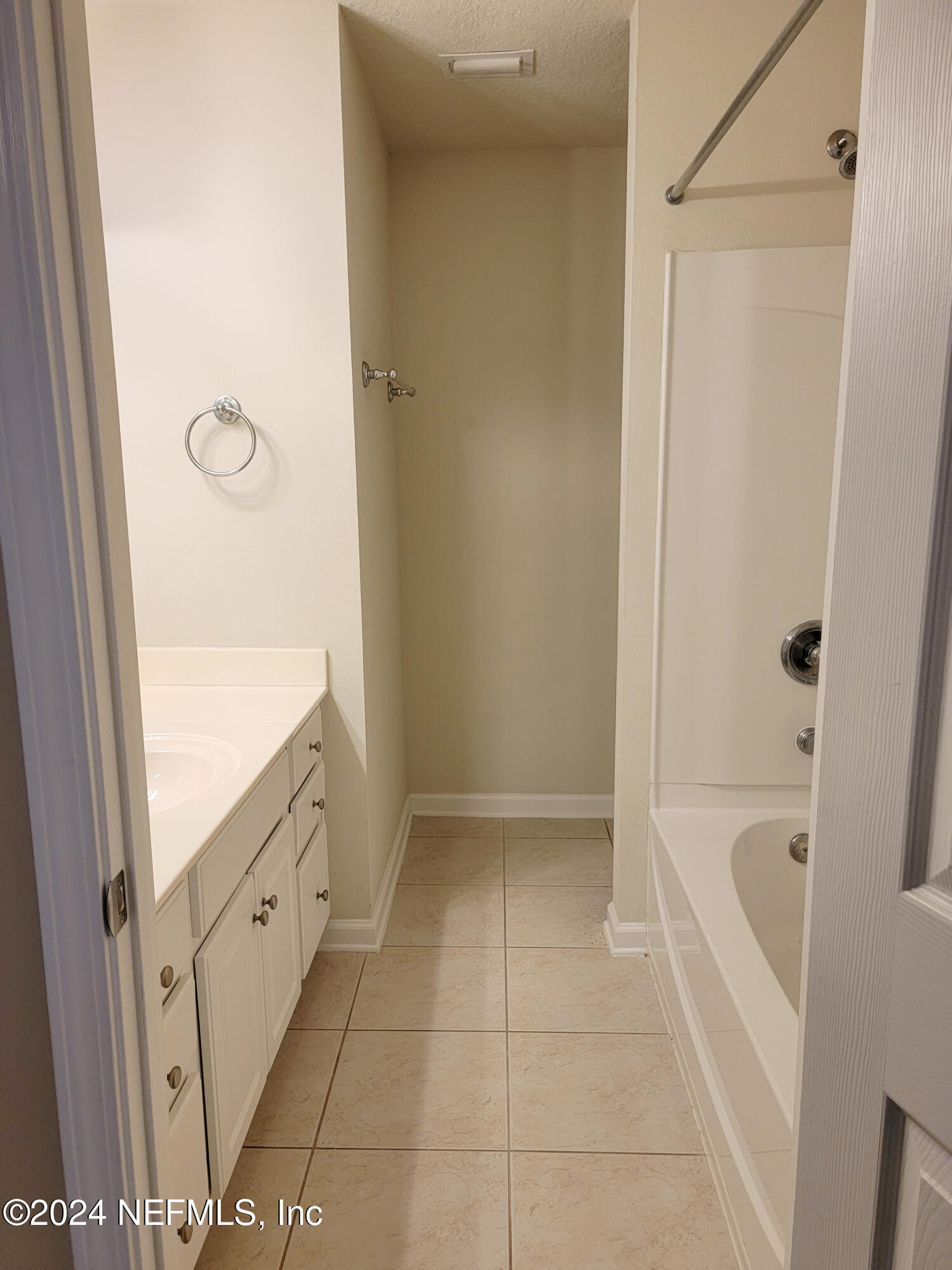 6801 Arching Branch Circle Jacksonville, FL 32258 - Photo 8 of 14 a bathroom with a tub shower and vanity