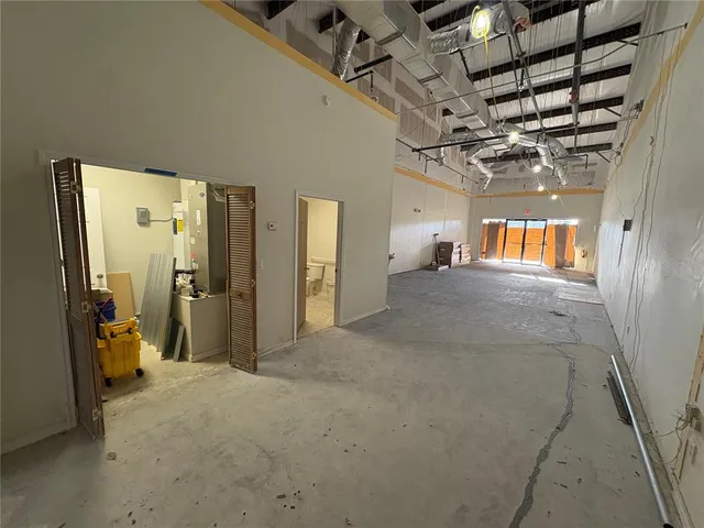 a view of a hallway with a room