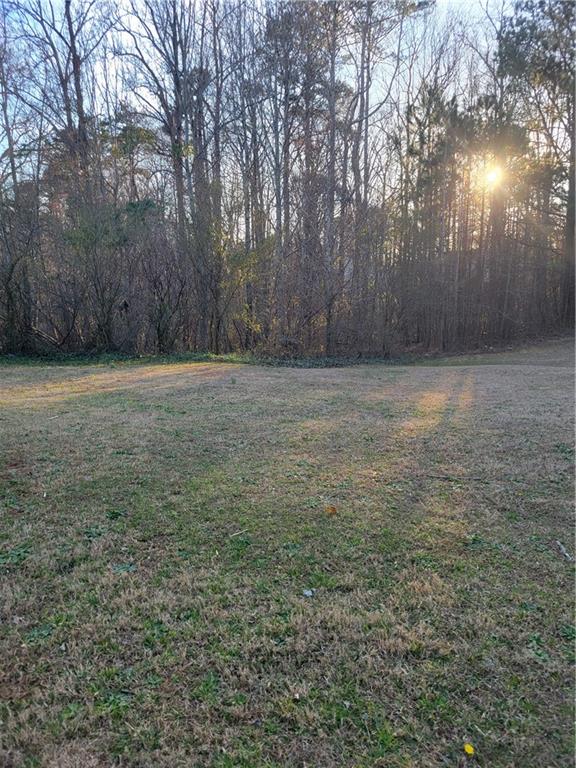 3134 Manorside Way Southwest Snellville, GA 30039 - Photo 3 of 4 a view of a yard with an trees
