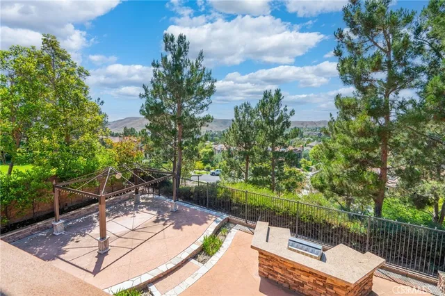 a view of a backyard with sitting area