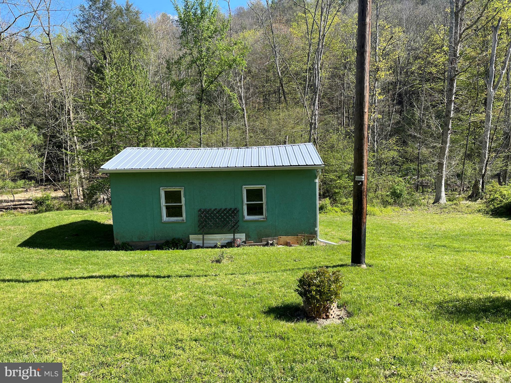 4217 Sugar Run Road Millerstown, PA 17062 - Photo 18 of 19 a front view of a house with garden