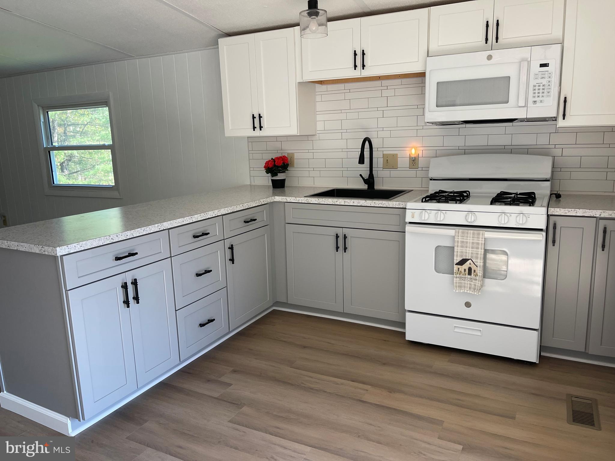 4217 Sugar Run Road Millerstown, PA 17062 - Photo 4 of 19 a kitchen with cabinets appliances a sink and a window