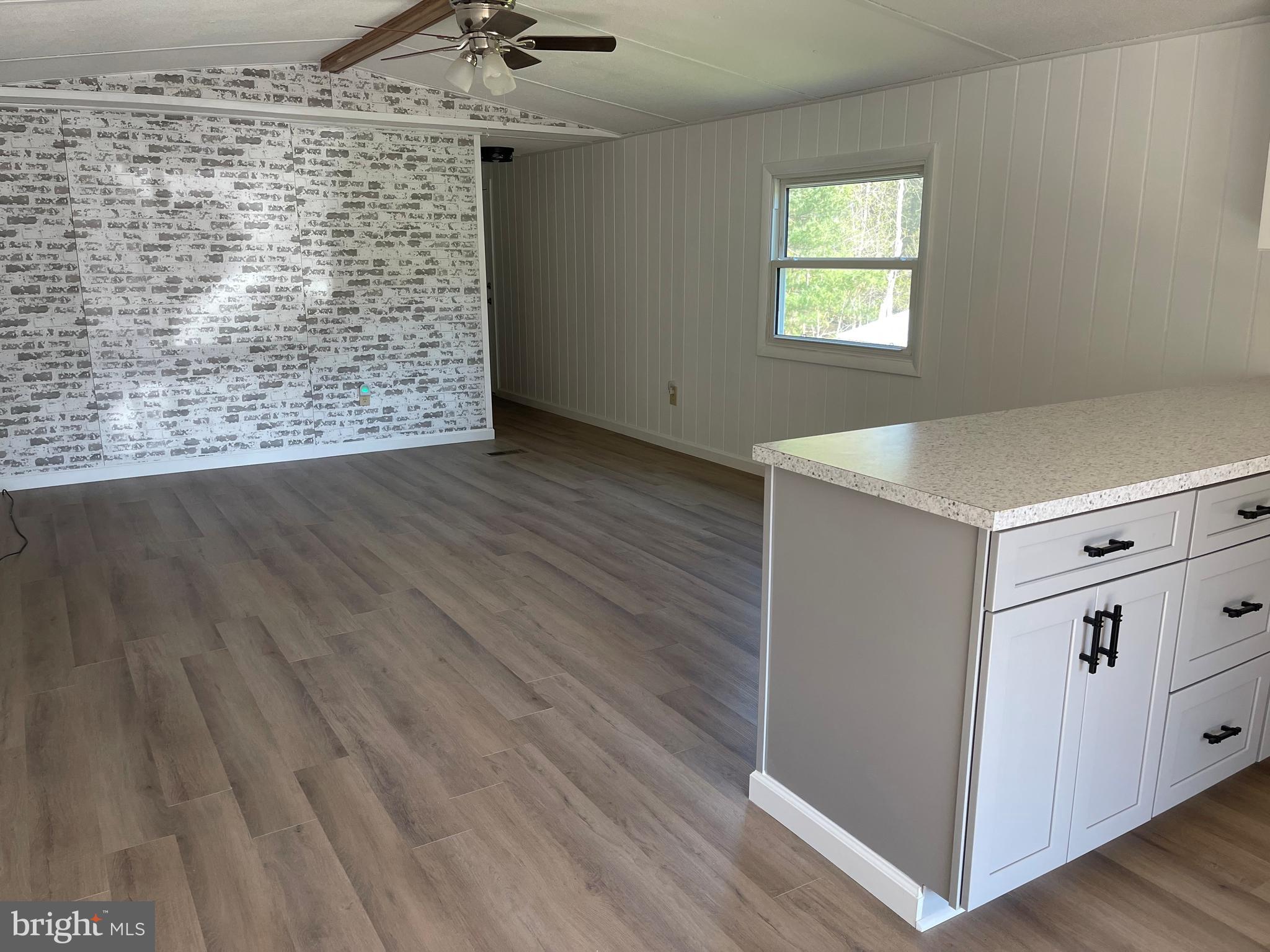 4217 Sugar Run Road Millerstown, PA 17062 - Photo 5 of 19 a view of empty room with wooden floor