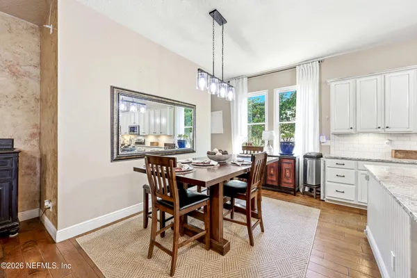 a view of a dining room with furniture window and outside view