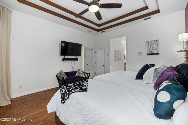a view of a livingroom with furniture and a ceiling fan