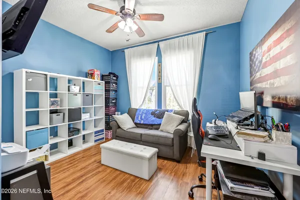 a view of a livingroom with furniture and a flat screen tv