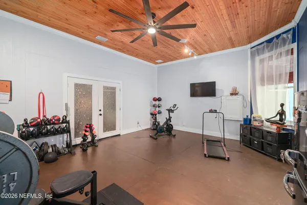 a bedroom with a bed and a desk