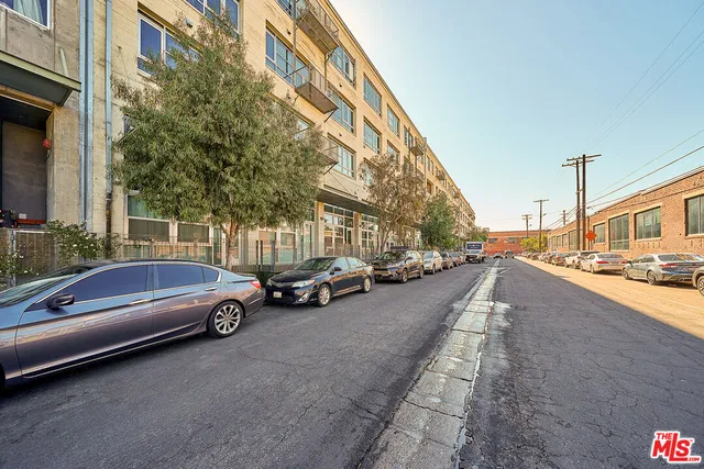 a view of a street with cars