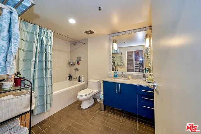 a bathroom with a toilet a sink and a bathtub
