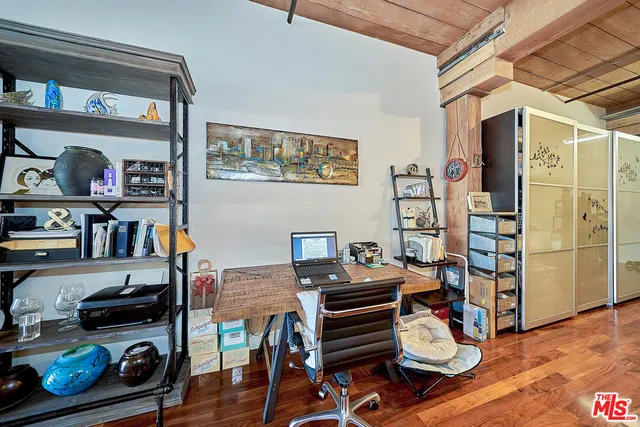 a workspace with furniture and wooden floor