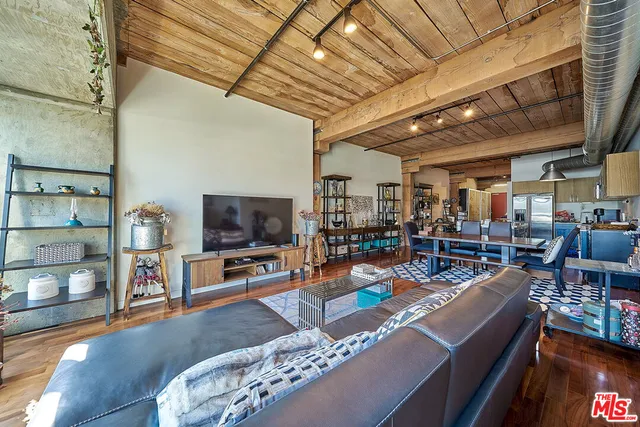 a living room with lots of furniture and a flat screen tv