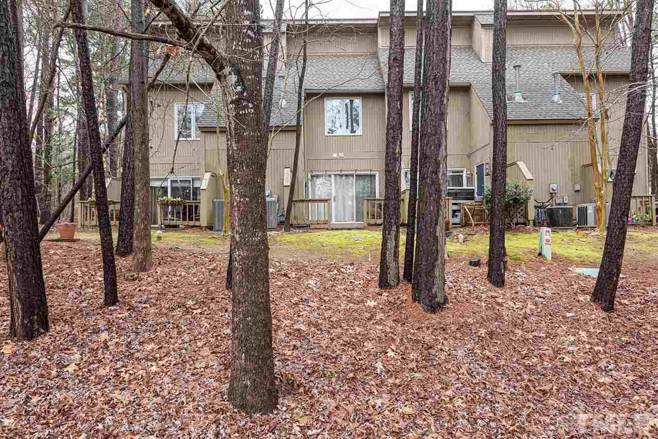 6305 Daystar Lane Raleigh, NC 27613 - Photo 19 of 19 a view of a house with a yard