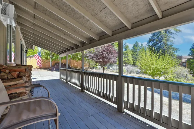 a view of a porch with wooden floor