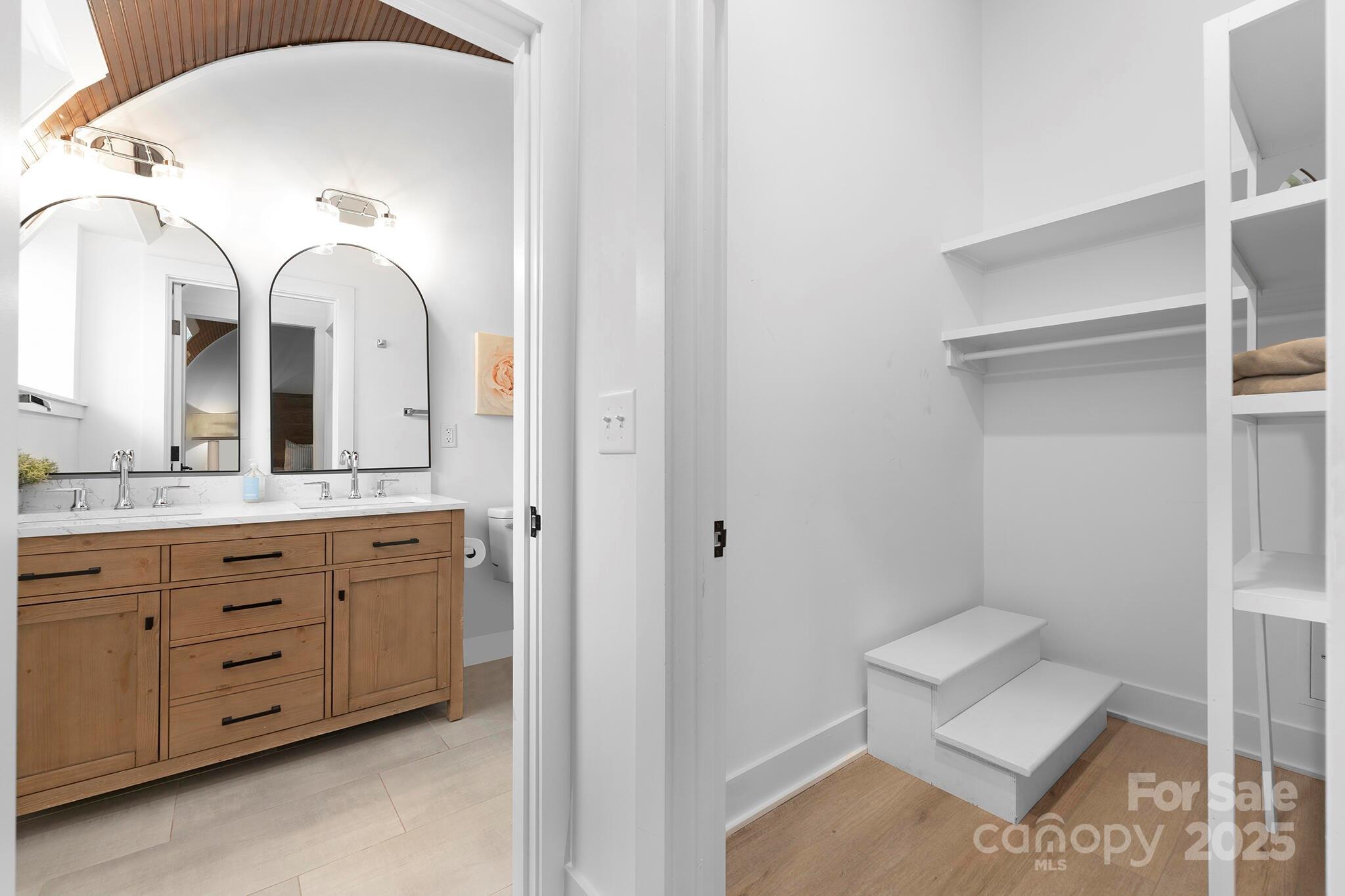 201 Grandin Road, Unit 13 Charlotte, NC 28208 - Photo 15 of 25 a bathroom with a double vanity sink and a mirror