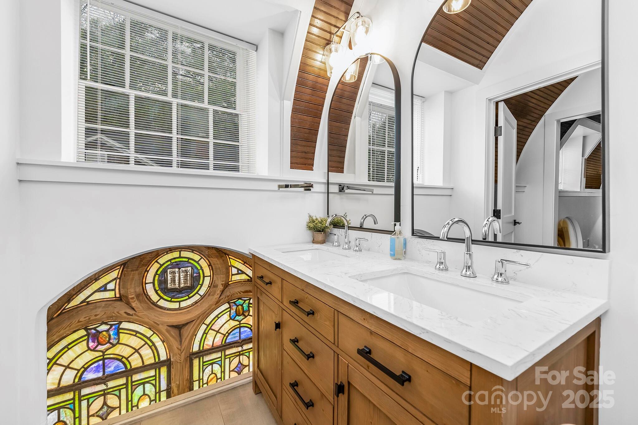 201 Grandin Road, Unit 13 Charlotte, NC 28208 - Photo 16 of 25 a bathroom with a sink and a mirror