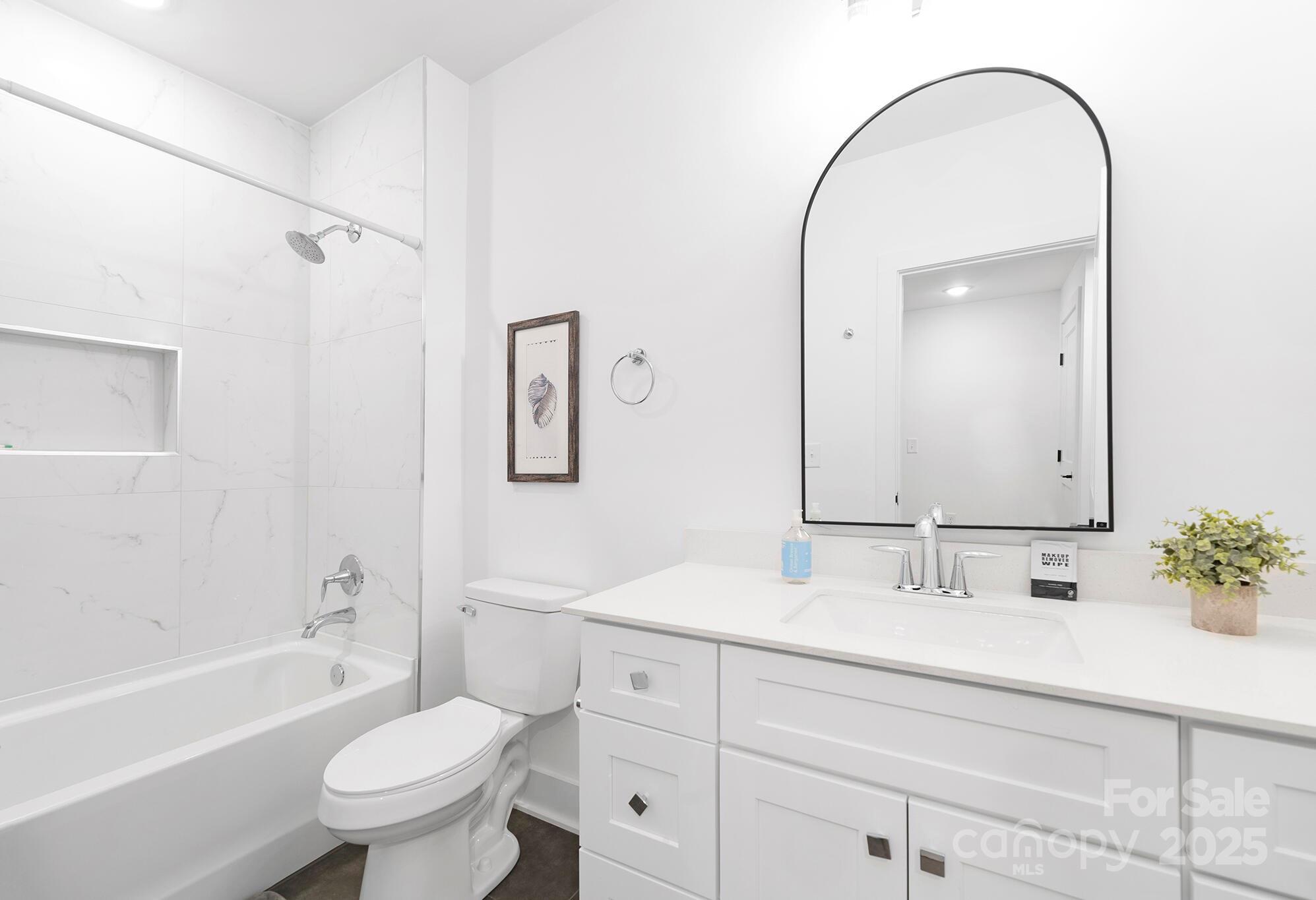 201 Grandin Road, Unit 13 Charlotte, NC 28208 - Photo 24 of 25 a bathroom with a sink and a mirror