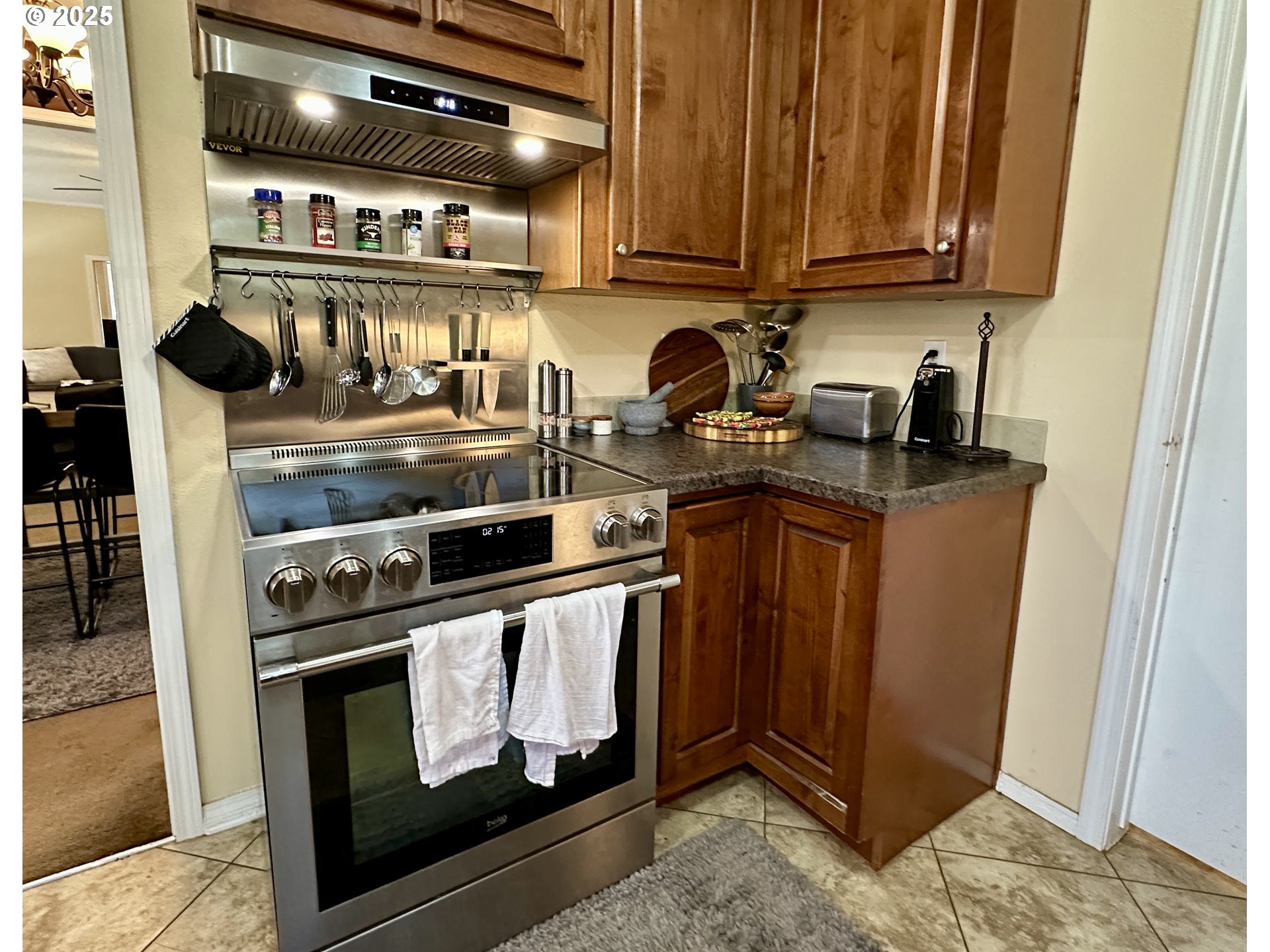48144 East Pine Creek Road Halfway, OR 97834 - Photo 11 of 48 a kitchen with stainless steel appliances granite countertop a stove a sink and a microwave
