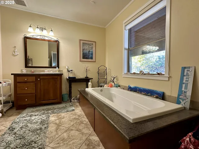 a bathroom with a sink a vanity and a mirror
