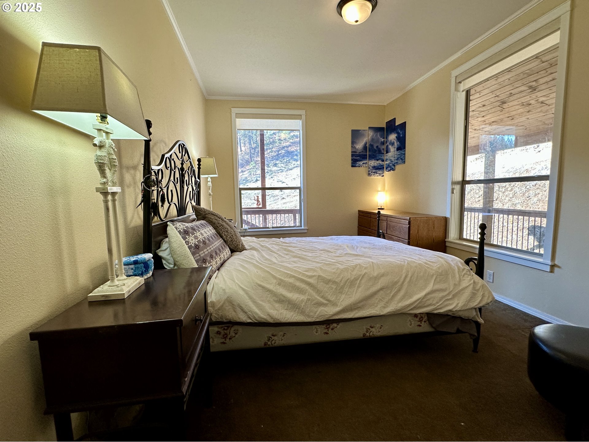 48144 East Pine Creek Road Halfway, OR 97834 - Photo 14 of 48 a bedroom with a bed and a window