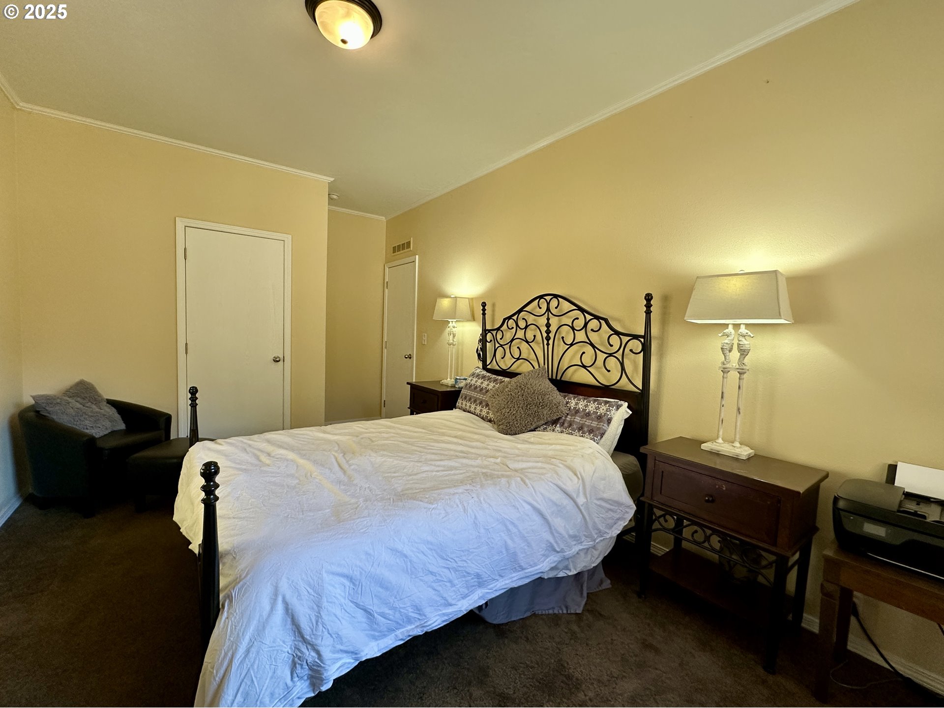 48144 East Pine Creek Road Halfway, OR 97834 - Photo 15 of 48 a bedroom with a bed and a lamp on table