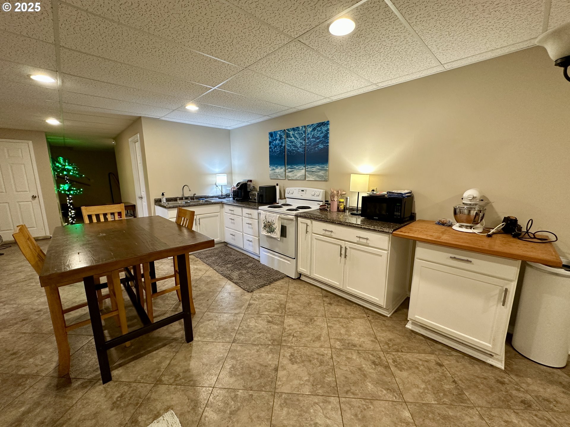 48144 East Pine Creek Road Halfway, OR 97834 - Photo 19 of 48 a kitchen with a sink a stove and chairs