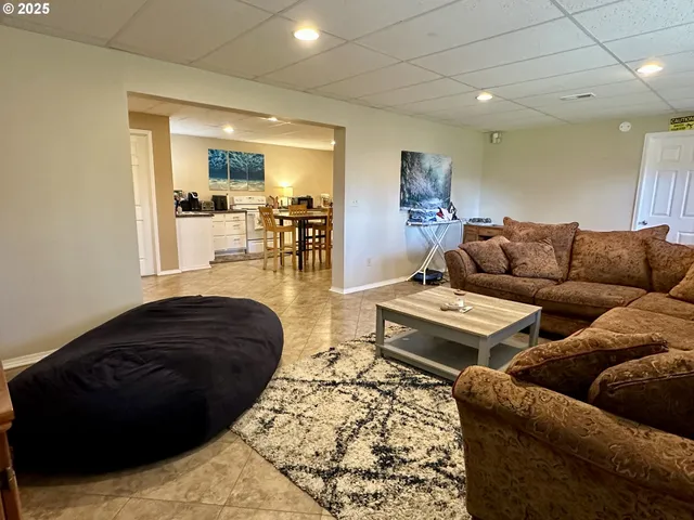 a bathroom with a granite countertop sink and mirror