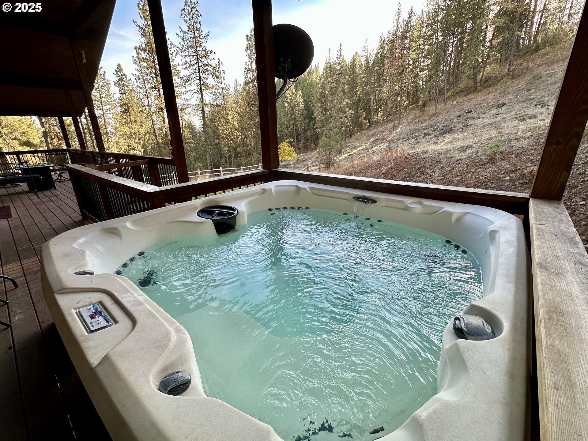 48144 East Pine Creek Road Halfway, OR 97834 - Photo 23 of 48 a bathroom with a granite countertop sink and mirror