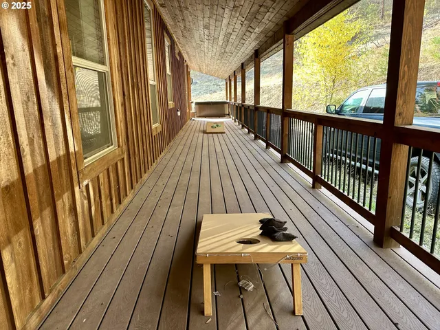a view of a balcony with wooden floor