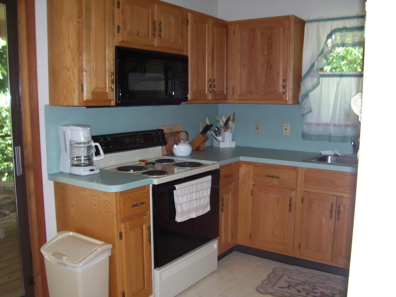 997 Canterbury Road Bushkill, PA 18324 - Photo 3 of 14 a kitchen with stainless steel appliances granite countertop a sink stove and microwave