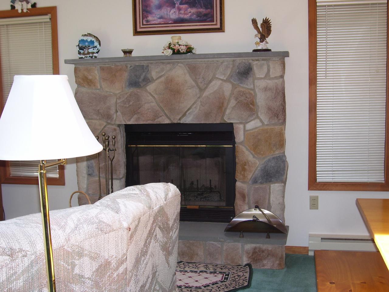 997 Canterbury Road Bushkill, PA 18324 - Photo 8 of 14 a living room with furniture and a fireplace