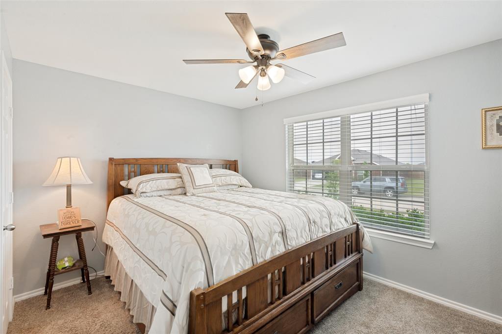 3905 Bridle Path Lane Sanger, TX 76266 - Photo 20 of 26 a bedroom with a bed and a window