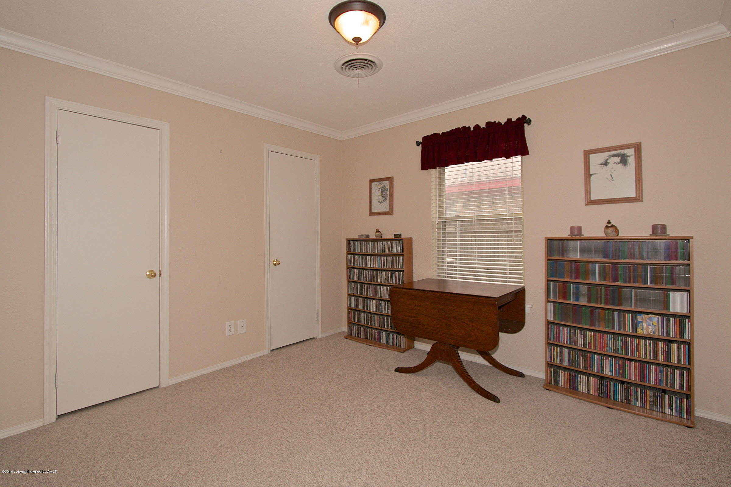 5701 South Fannin Street Amarillo, TX 79110 - Photo 11 of 15 a view of a workspace with furniture and a window