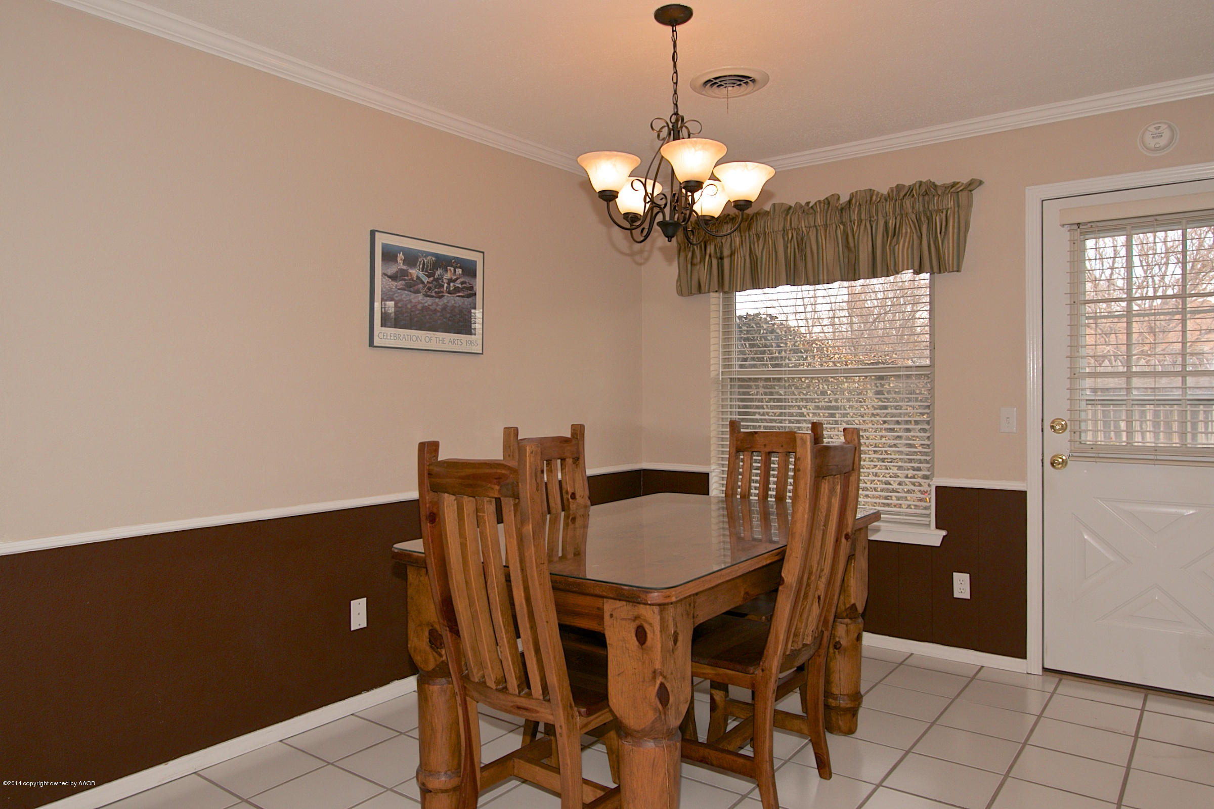 5701 South Fannin Street Amarillo, TX 79110 - Photo 6 of 15 a view of a dining room with furniture and chandelier