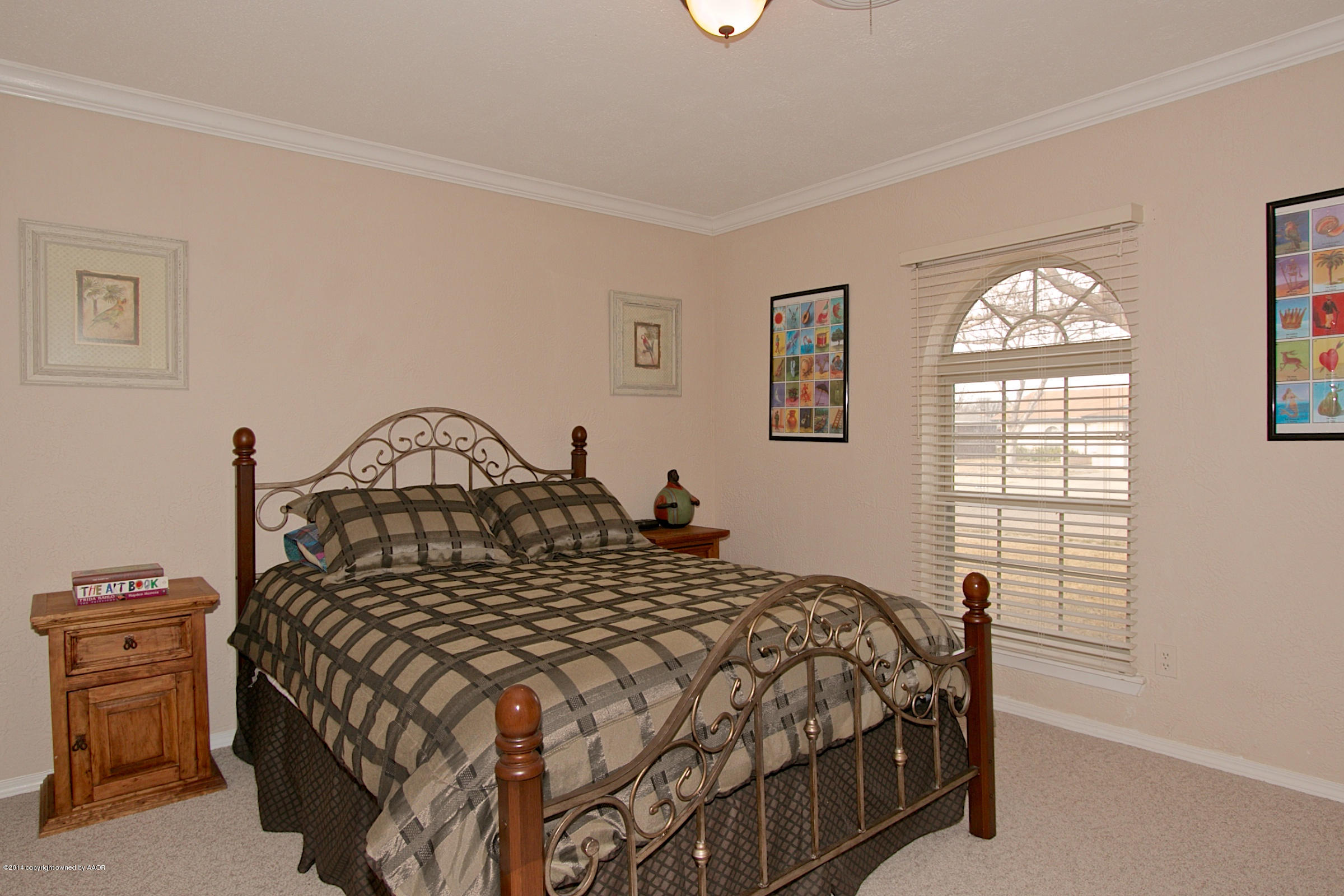 5701 South Fannin Street Amarillo, TX 79110 - Photo 9 of 15 a bedroom with a bed and a window