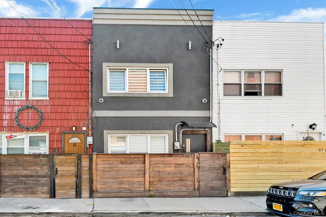 a view of a brick house with a street