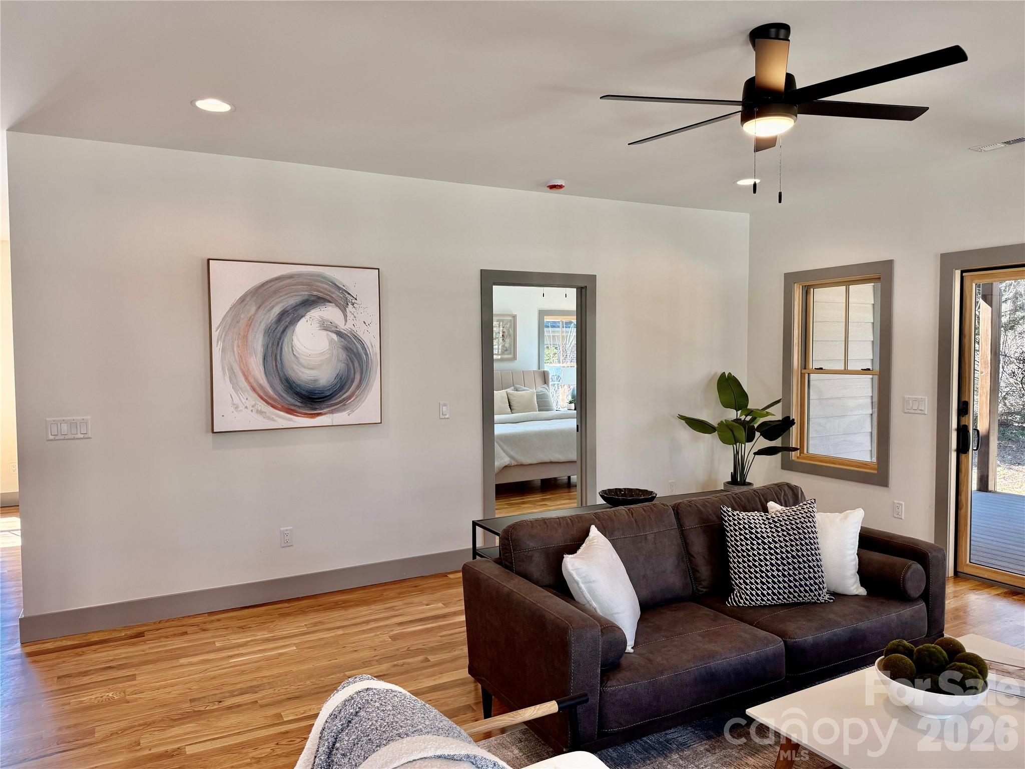 314 Gallimore Road Brevard, NC 28712 - Photo 17 of 38 a living room with furniture and a wooden floor