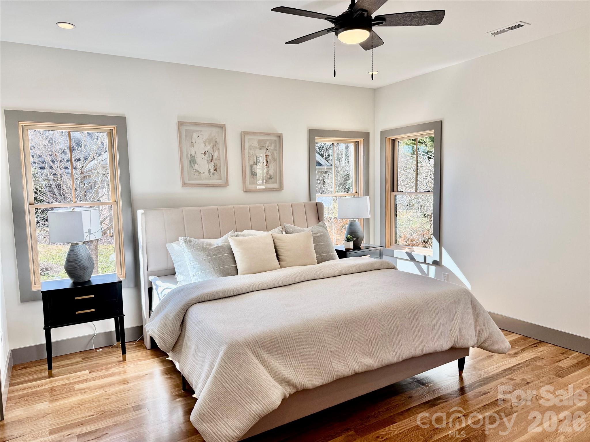 314 Gallimore Road Brevard, NC 28712 - Photo 18 of 38 a bedroom with a bed and wooden floor