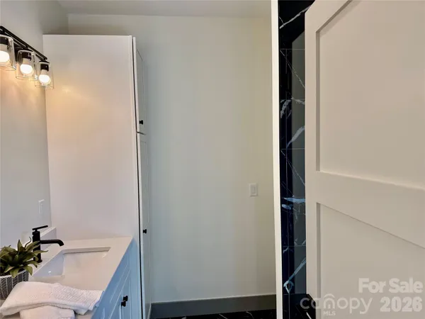 a hallway with a sink