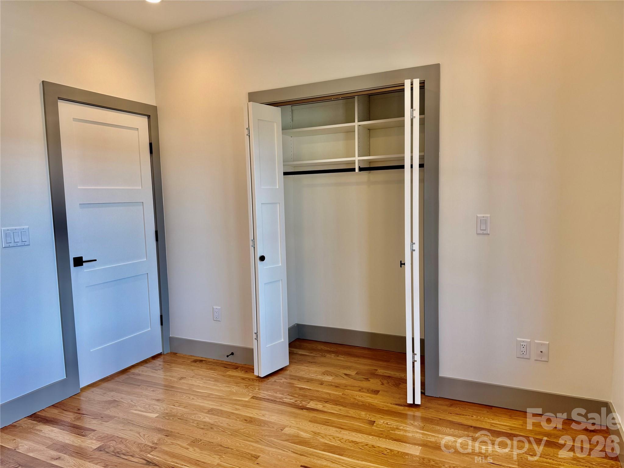 314 Gallimore Road Brevard, NC 28712 - Photo 28 of 38 a view of an empty room with wooden floor and closet